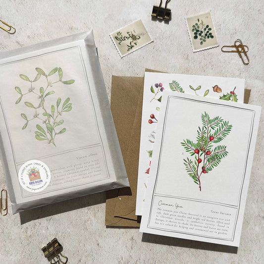Set of botanical cards and envelopes on a textured surface