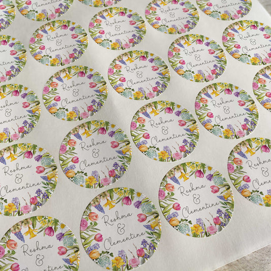 Sheet of round stickers with floral designs and text on a white background
