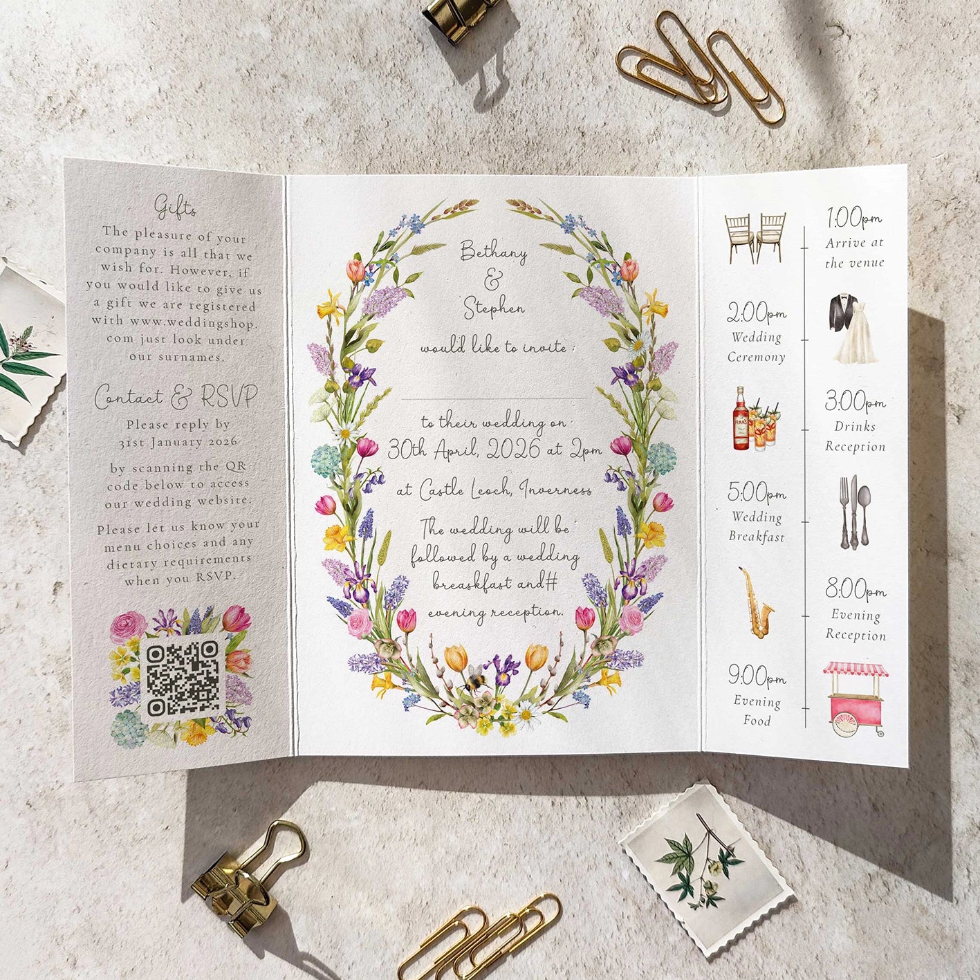Wedding invitation card with floral design on a textured surface