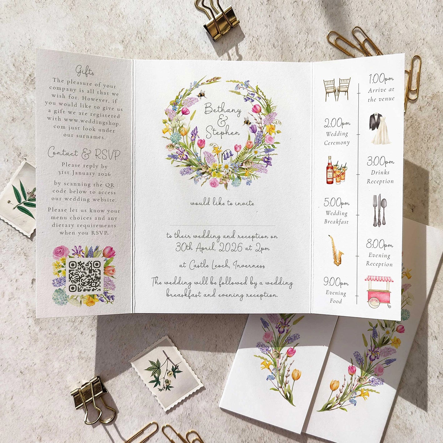 Wedding invitation card with floral design and event schedule on a textured surface.