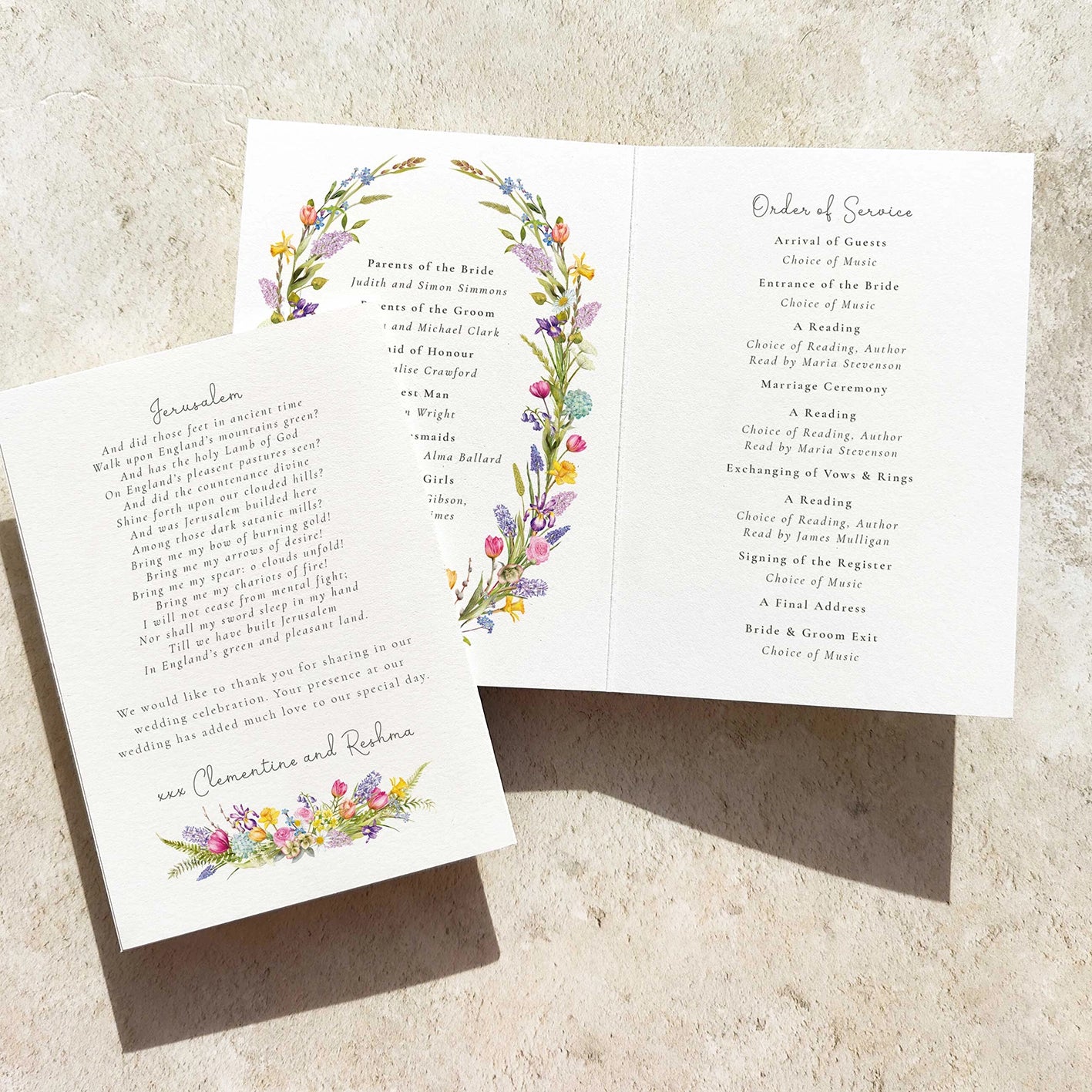 Wedding program with floral design on a textured surface