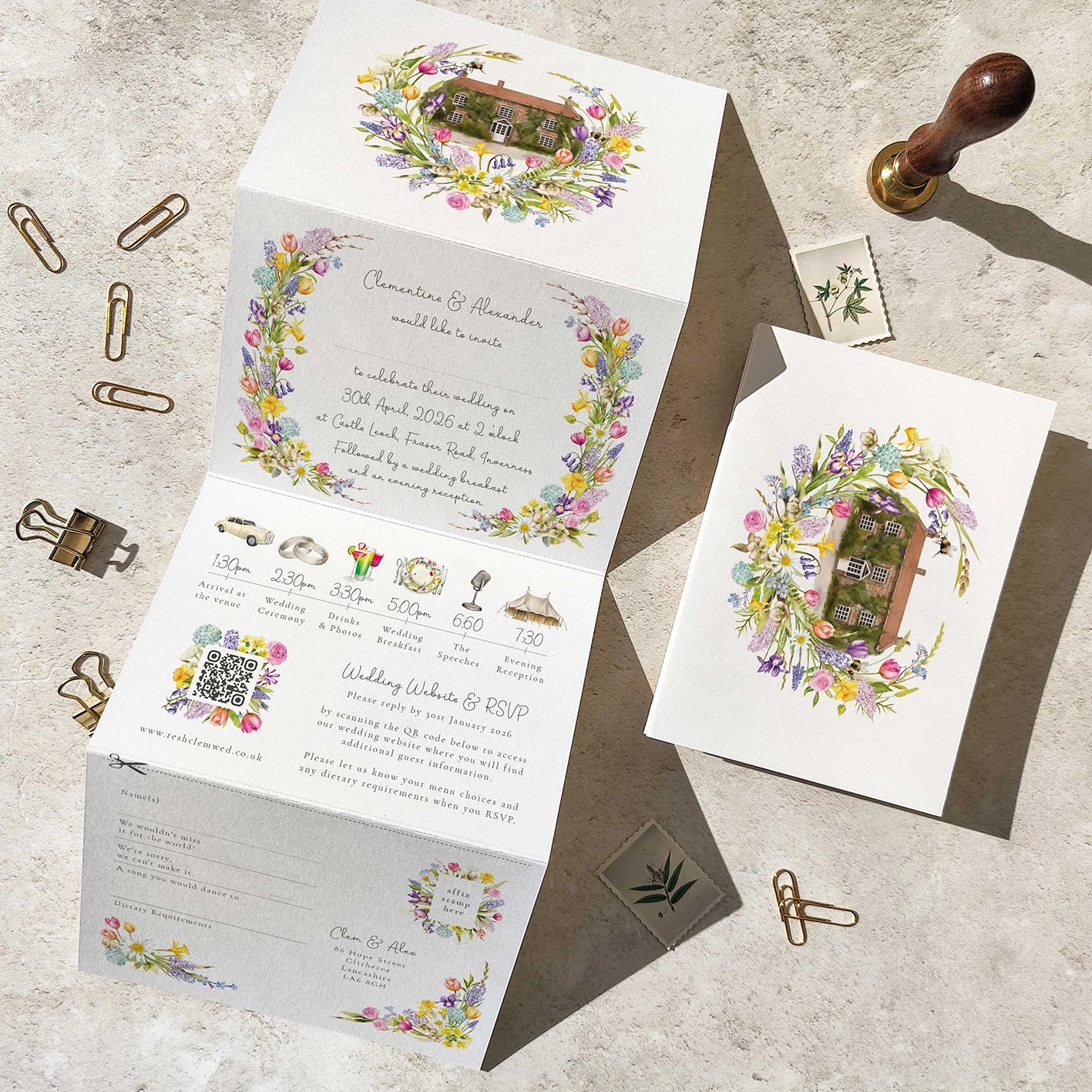 Wedding invitation set with floral designs on a textured surface