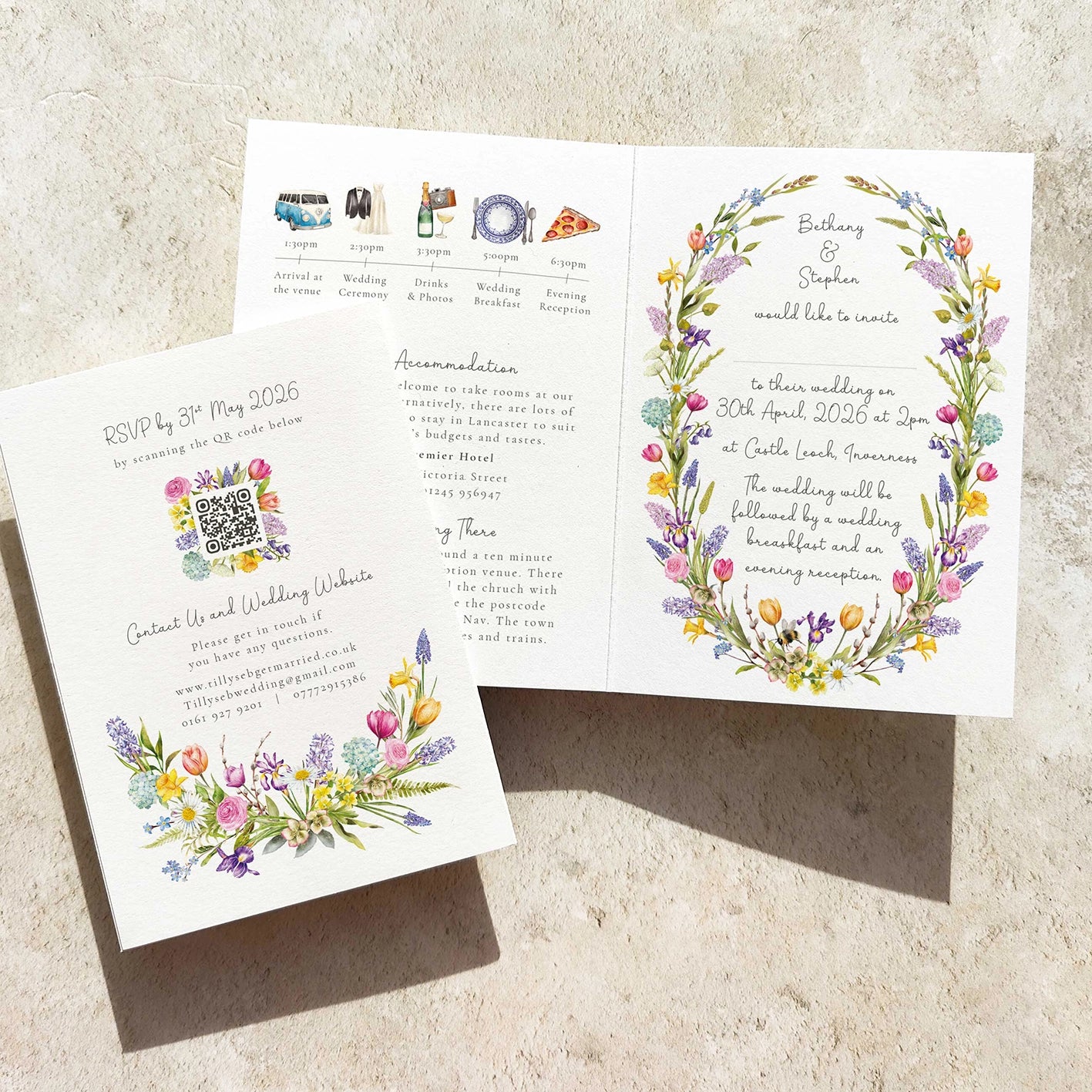 Wedding invitation card with floral design on a textured surface