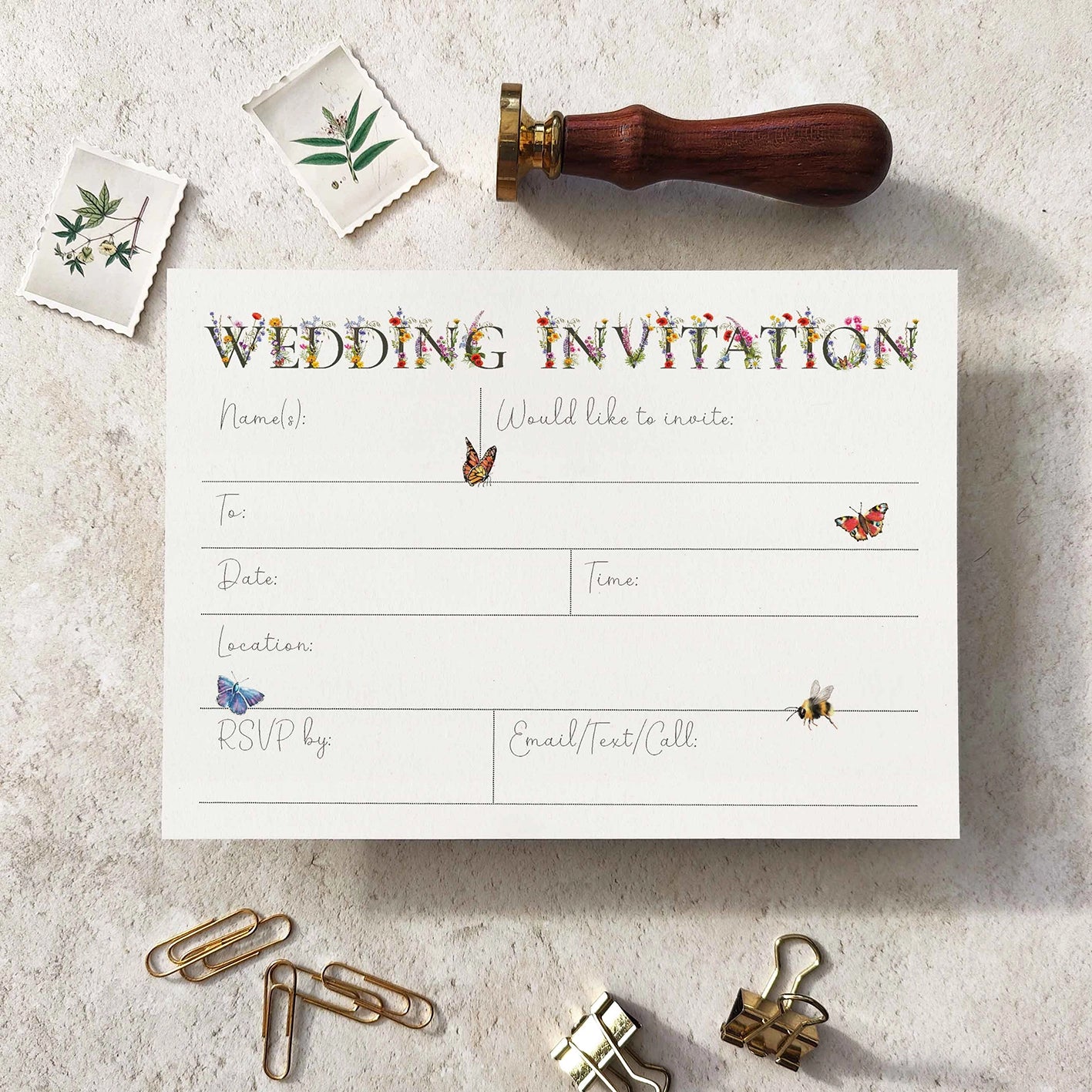 Wedding invitation card with decorative elements on a textured surface