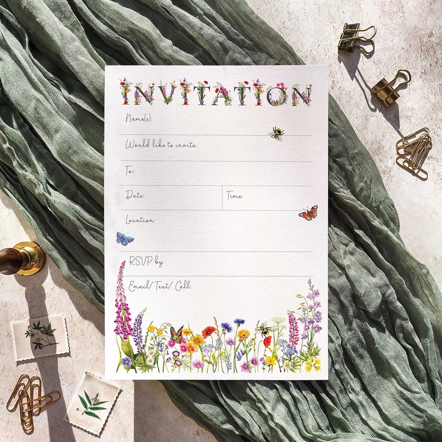 Invitation card with floral and insect design on a textured fabric background