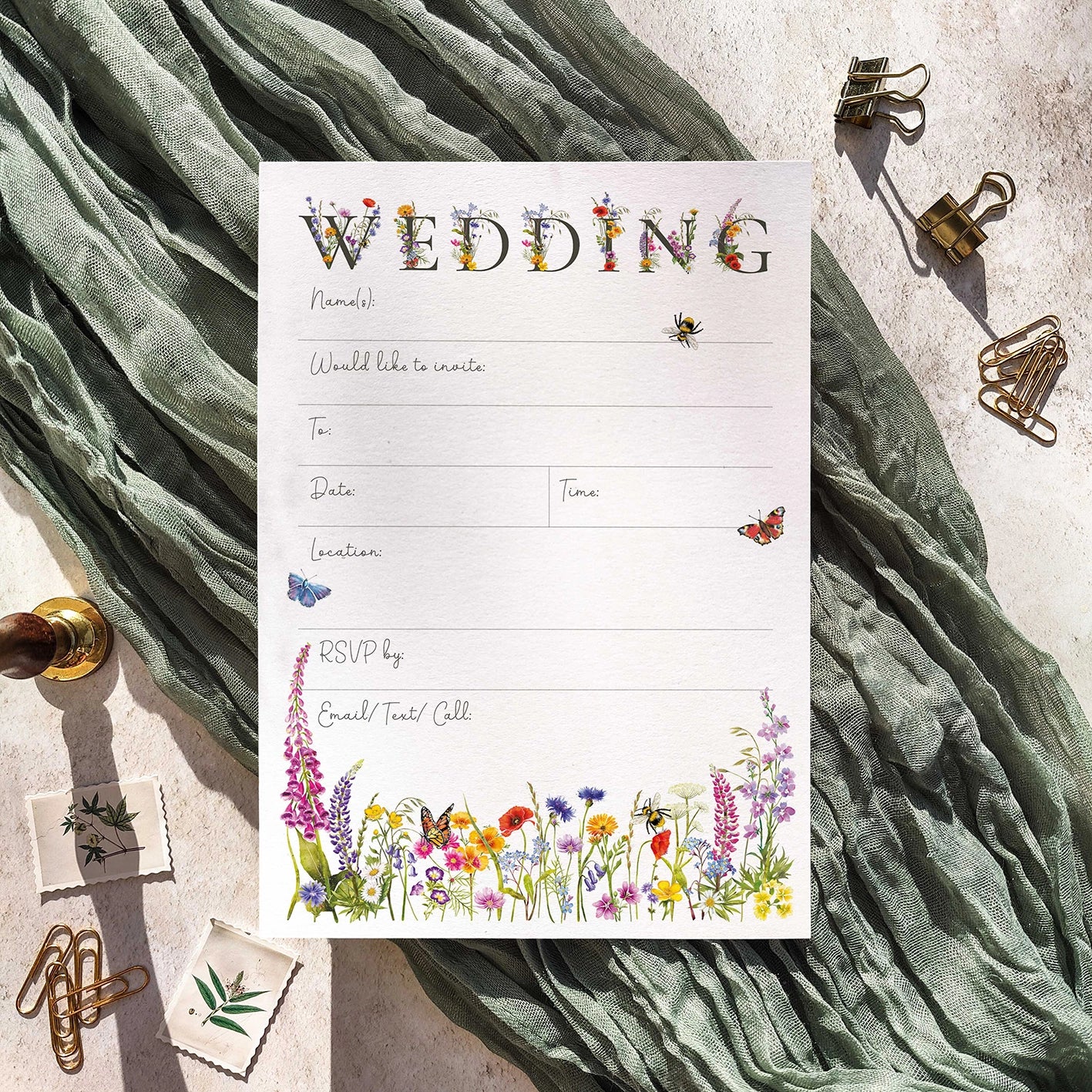 Wedding invitation card with floral design on a textured fabric background
