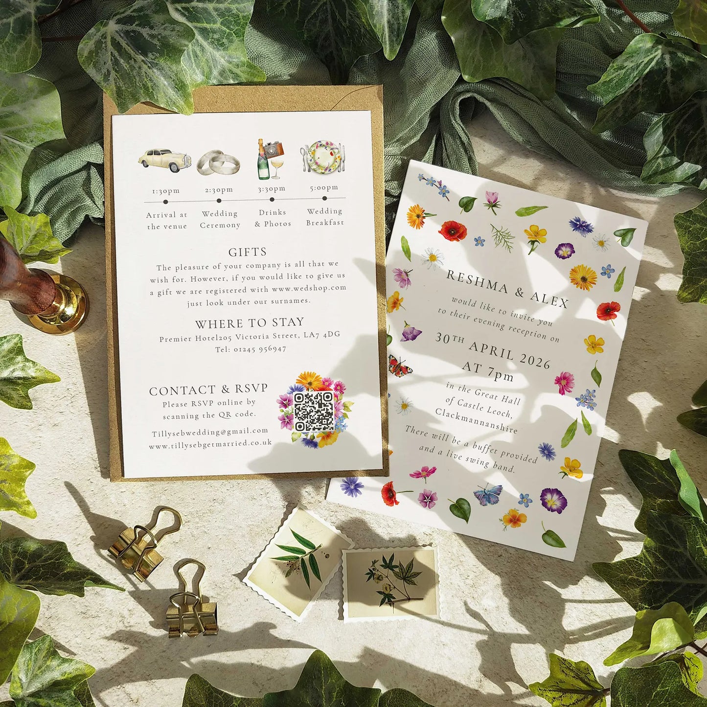 Wedding invitation with QR code, stationery items, and floral design on a leafy background