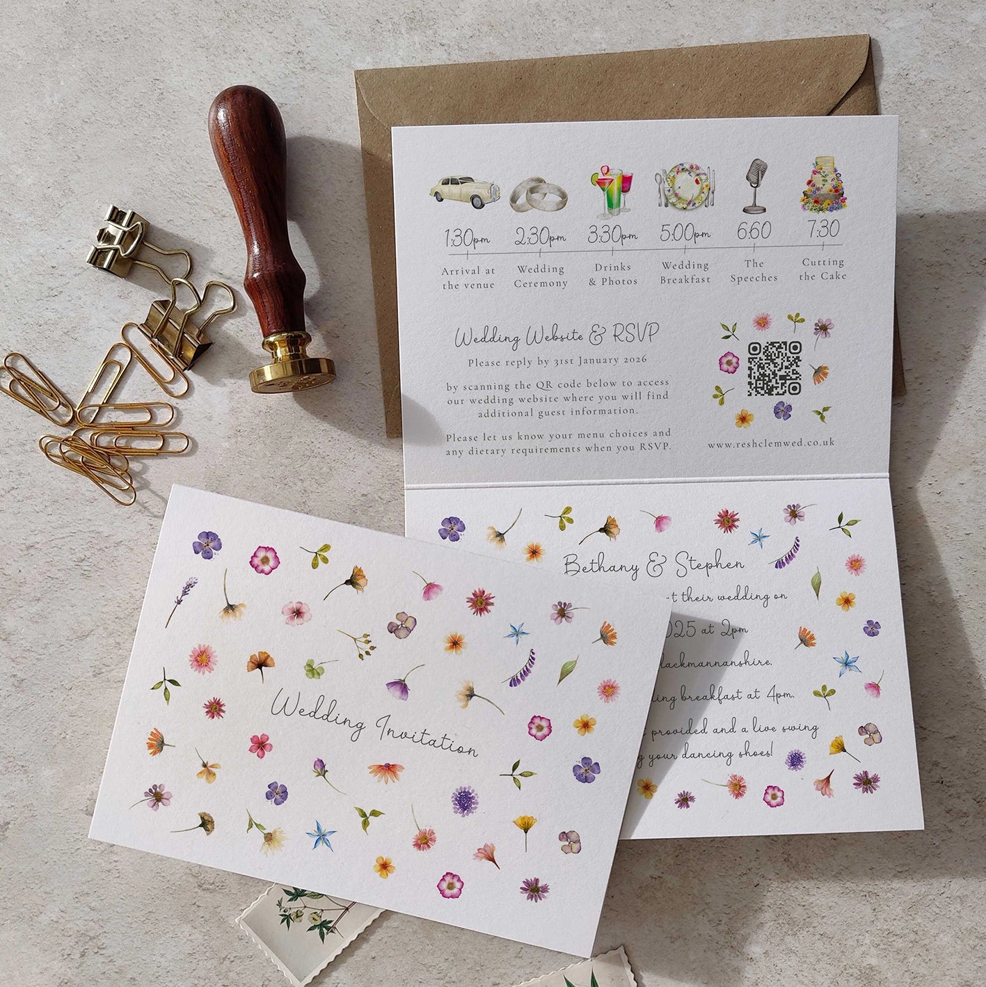 Wedding invitation card with floral design on a textured surface