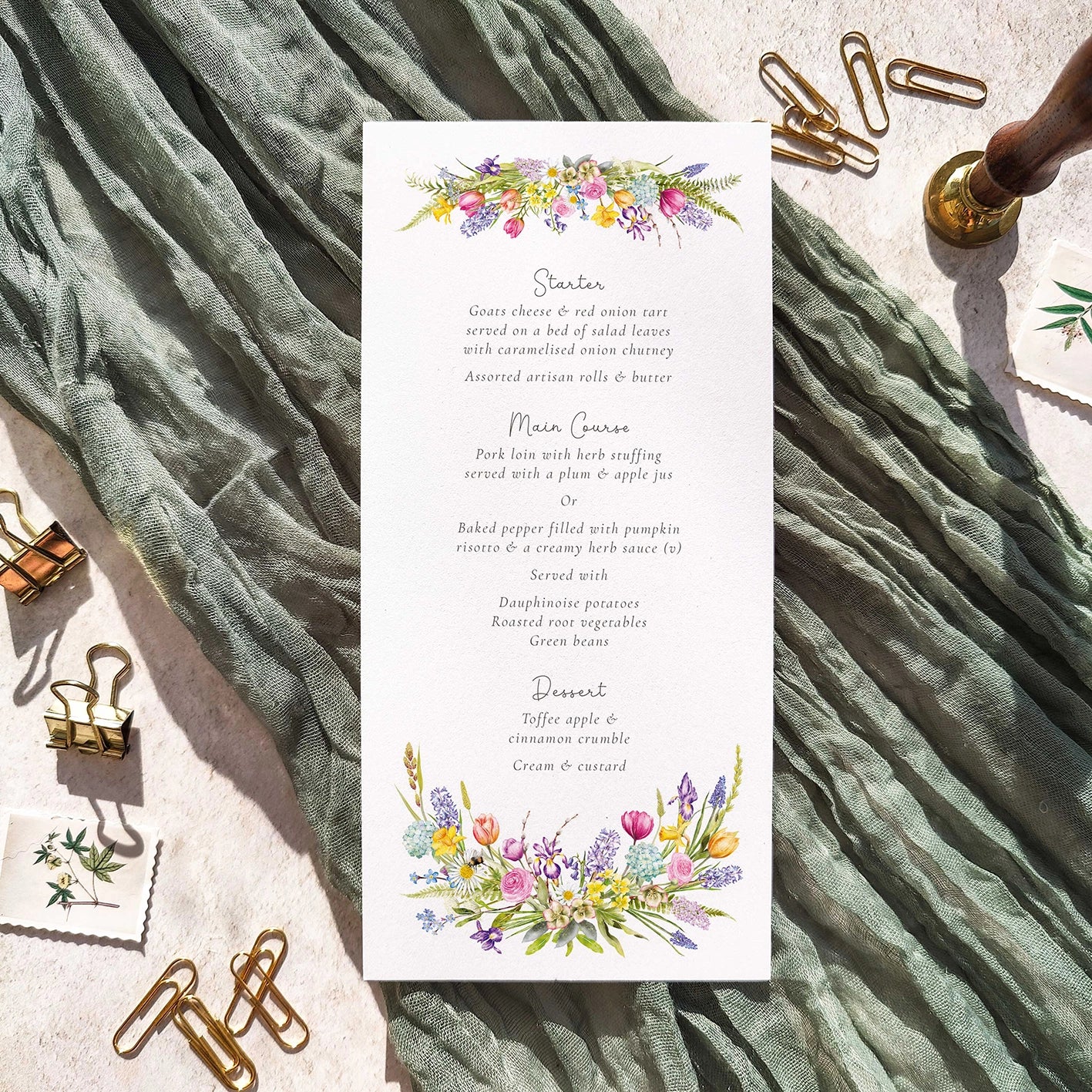 Wedding Menu with spring floral design on a textured fabric background