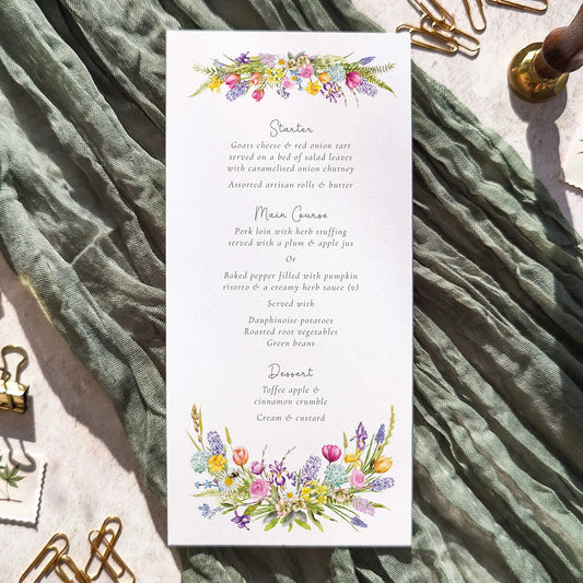 Wedding Menu with spring flowers floral design on a textured fabric background